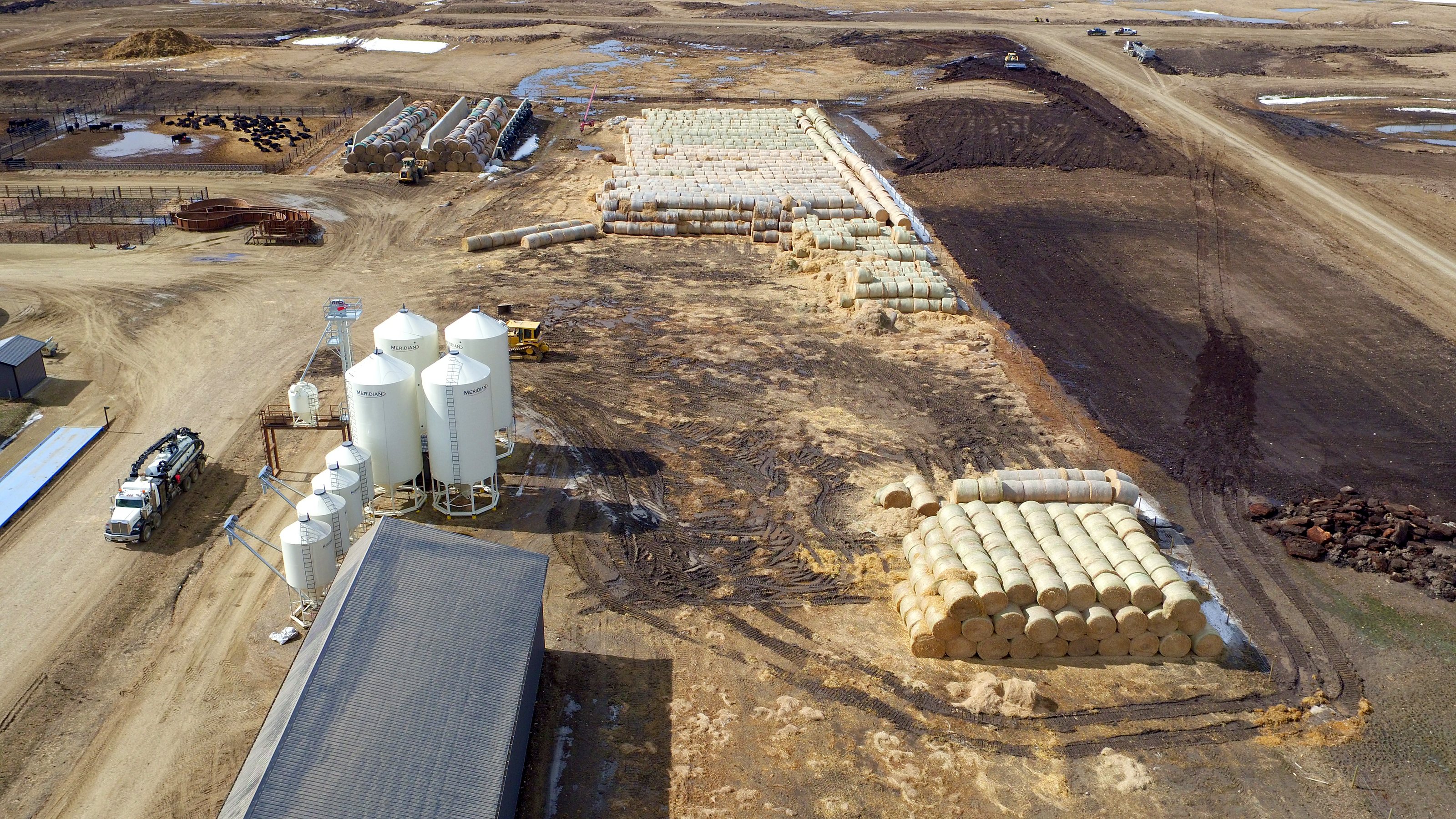The bale yard and the grain bins in spring, from the air