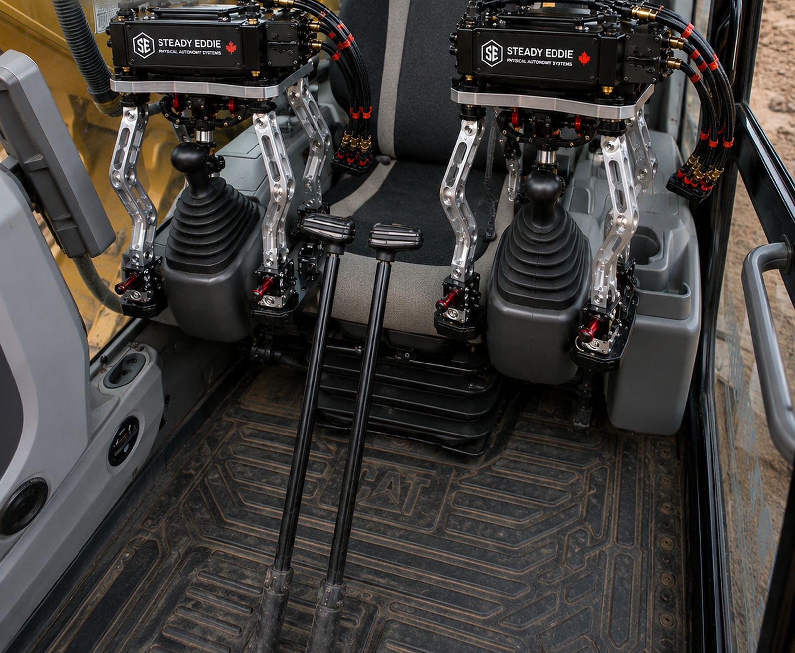 Two Steady Eddie units in an excavator seat, on the machine's own joysticks